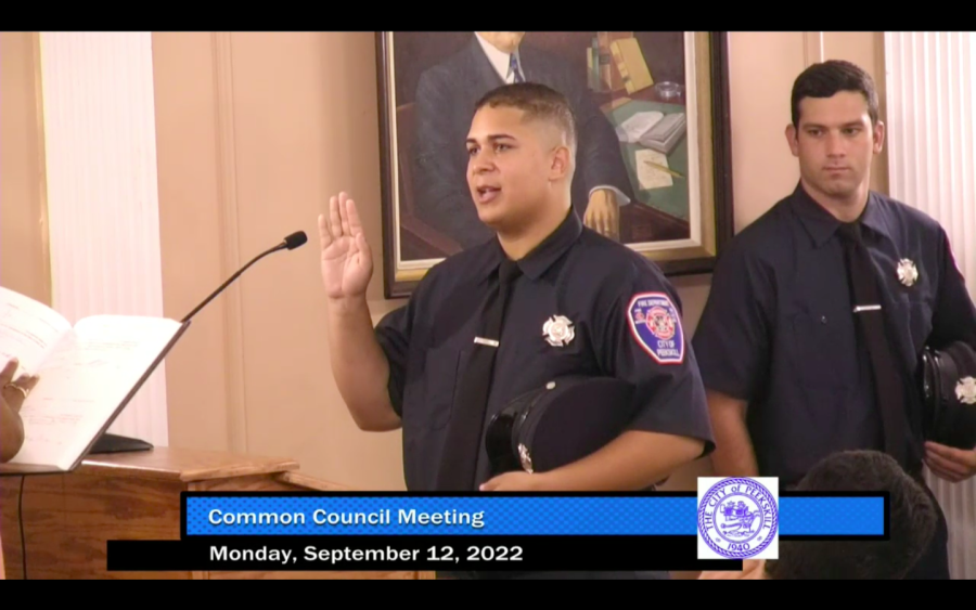 Marcos+Suarez+takes+the+oath+to+be+a+firefighter+in+Peekskill+while+Rocco+Picciano+looks+on+at+City+Hall+Monday+night.+