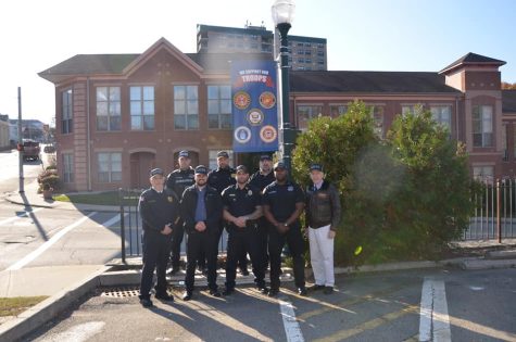 Members of Peekskills police force who have served in the armed forces with Dr. McGurty outside Peekskills police station. 