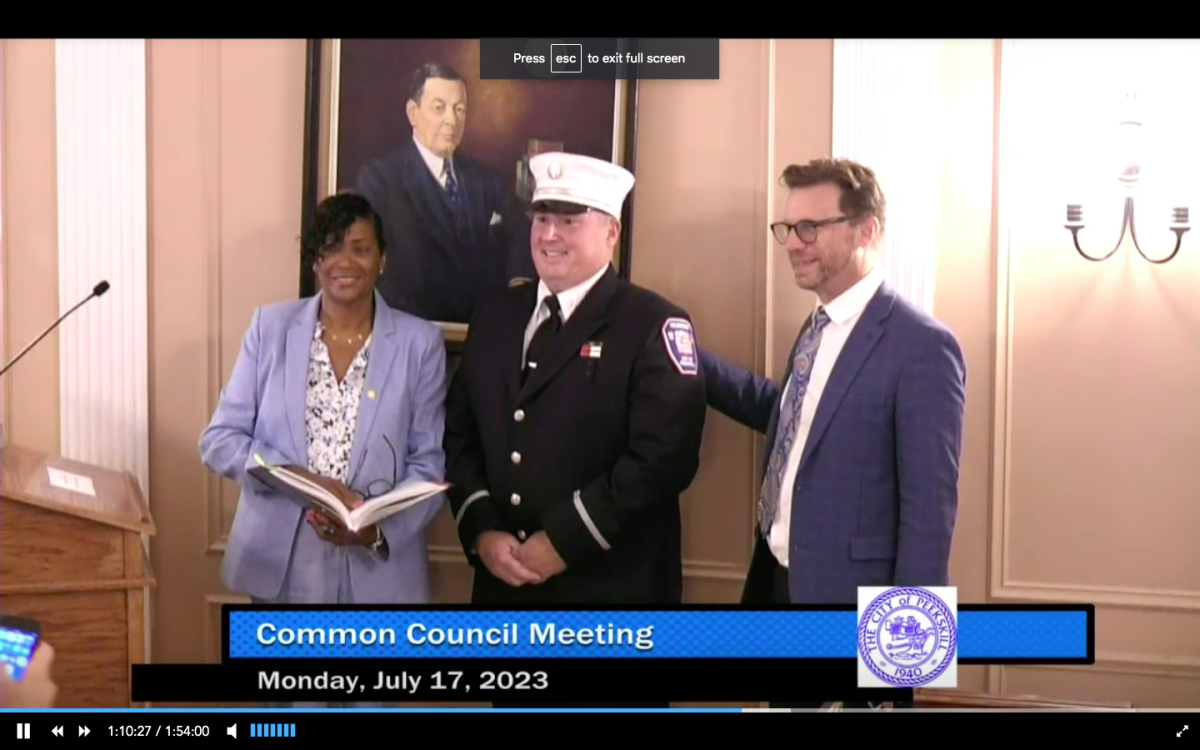 Mayor Vivian McKenzie with newly promoted Fire Lt. Patrick MacLennan and City Manager Matt Alexander at Mondays Common Council meeting. His parents and family along with members of the fire department were present to witness the swearing in. 