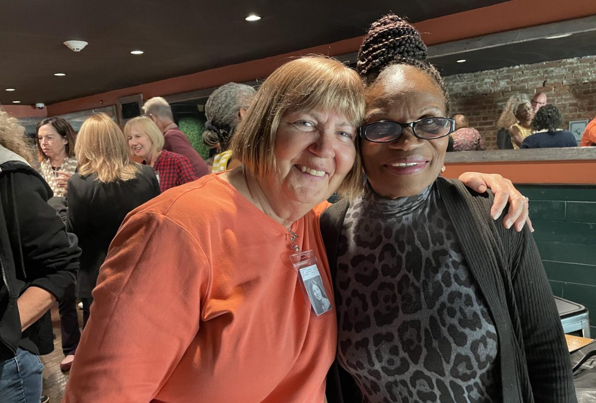 One of the reunion organizers Anne Valente, left, with Sue Ellen Morrison at Slainte on Friday evening.  (Photo by Regina Clarkin) 