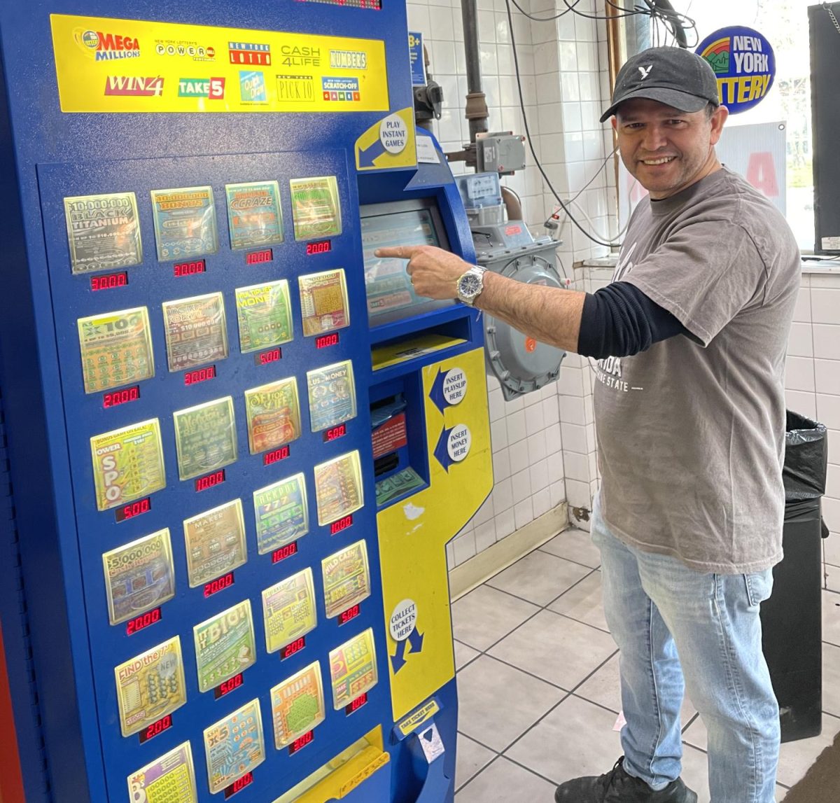 Raphael Lopez with the machine that produced a winning scratch off in September. 
