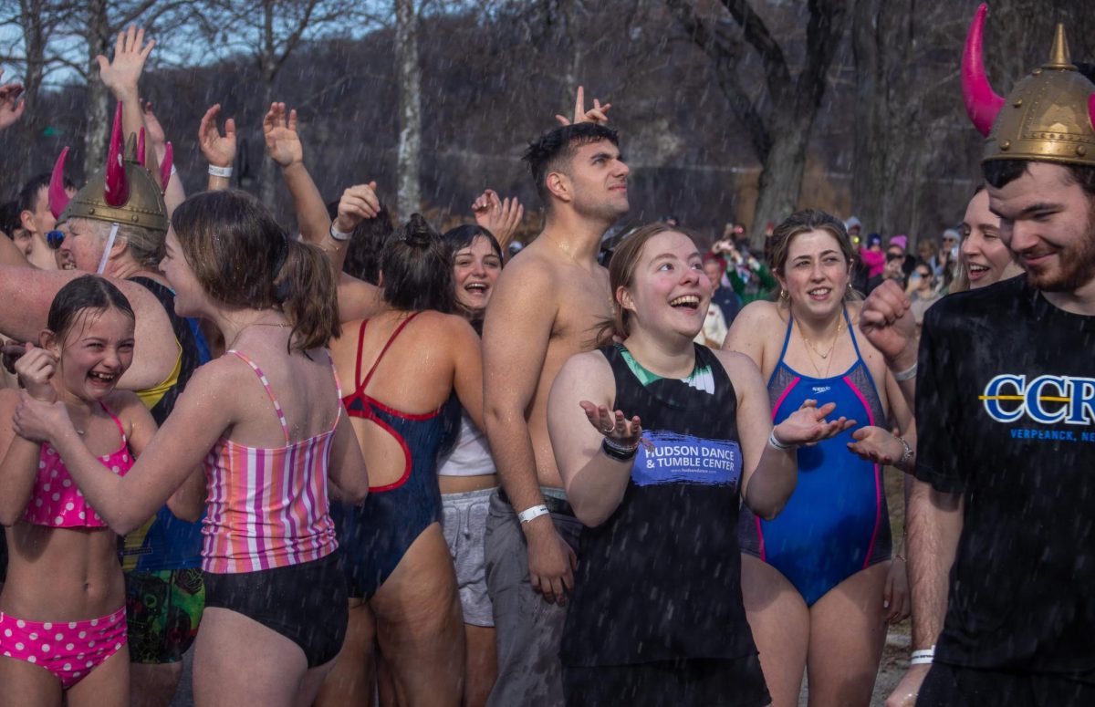 A record number of participants signed up to get wet in the 40+ degree weather on New Years Day. (Photo by Chloe Trieff) 