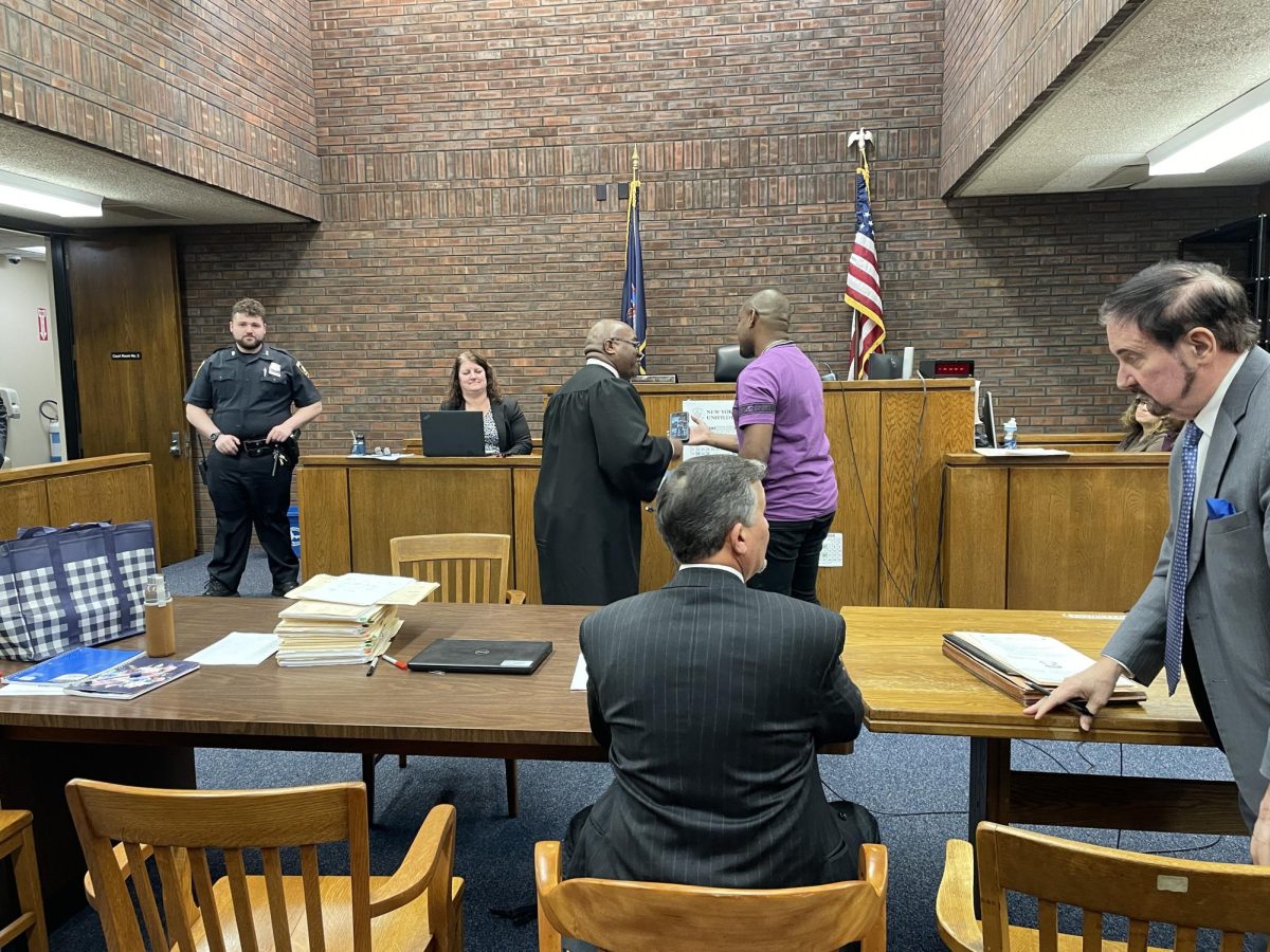The scene in the courtroom as Brian Bailey is given his certification of completion from Judge Johnson. In the foreground are representatives from the Westchester County District Attorneys office and lawyers specifically designated as drug court attorneys. 