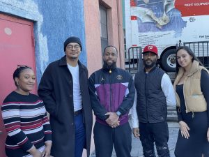 The owners of Red Door Creative Space in front of the location in downtown Peekskill. From left, Asia Murrell, Muhammed Patterson, Naheem Gross, Pernell Gross and Miriam Guerrero. (Photo by Regina Clarkin) 