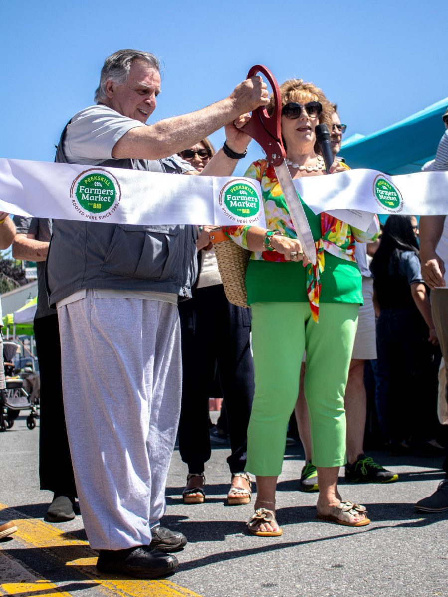 Richard Rogers, president of the Peekskill BID and Deputy Mayor Patricia Riley cutting the opening day ribbon. 