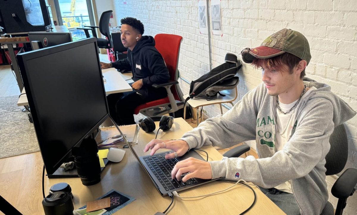 Enzo Monticello (with hat) an apprentice at Bantam Tools works alongside sales manager Onell Guichardo (Photo by Jeff Merchan)