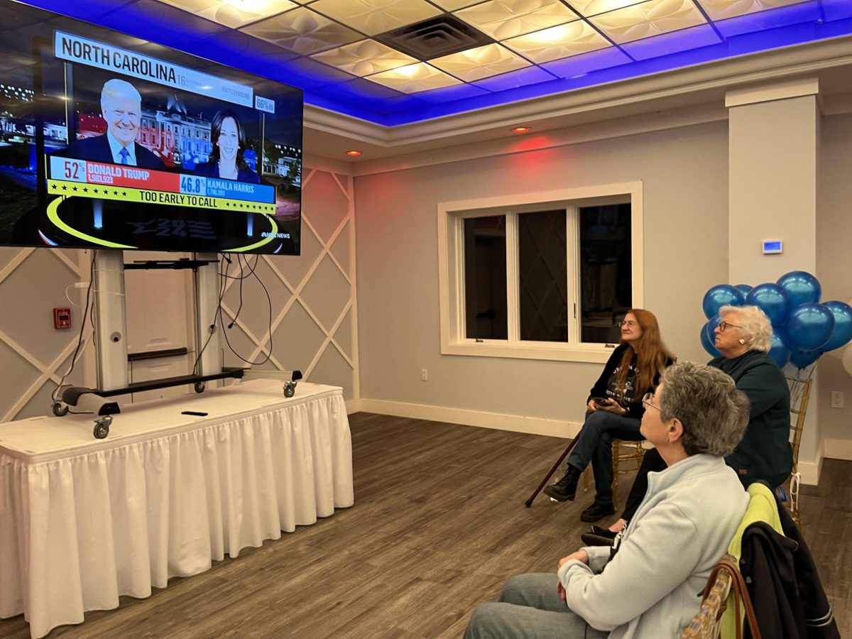 Westchester County voters, including former Assemblywoman Sandy Galef in the middle, watch election returns at the Travelers Rest in Ossining, on Nov. 5.

