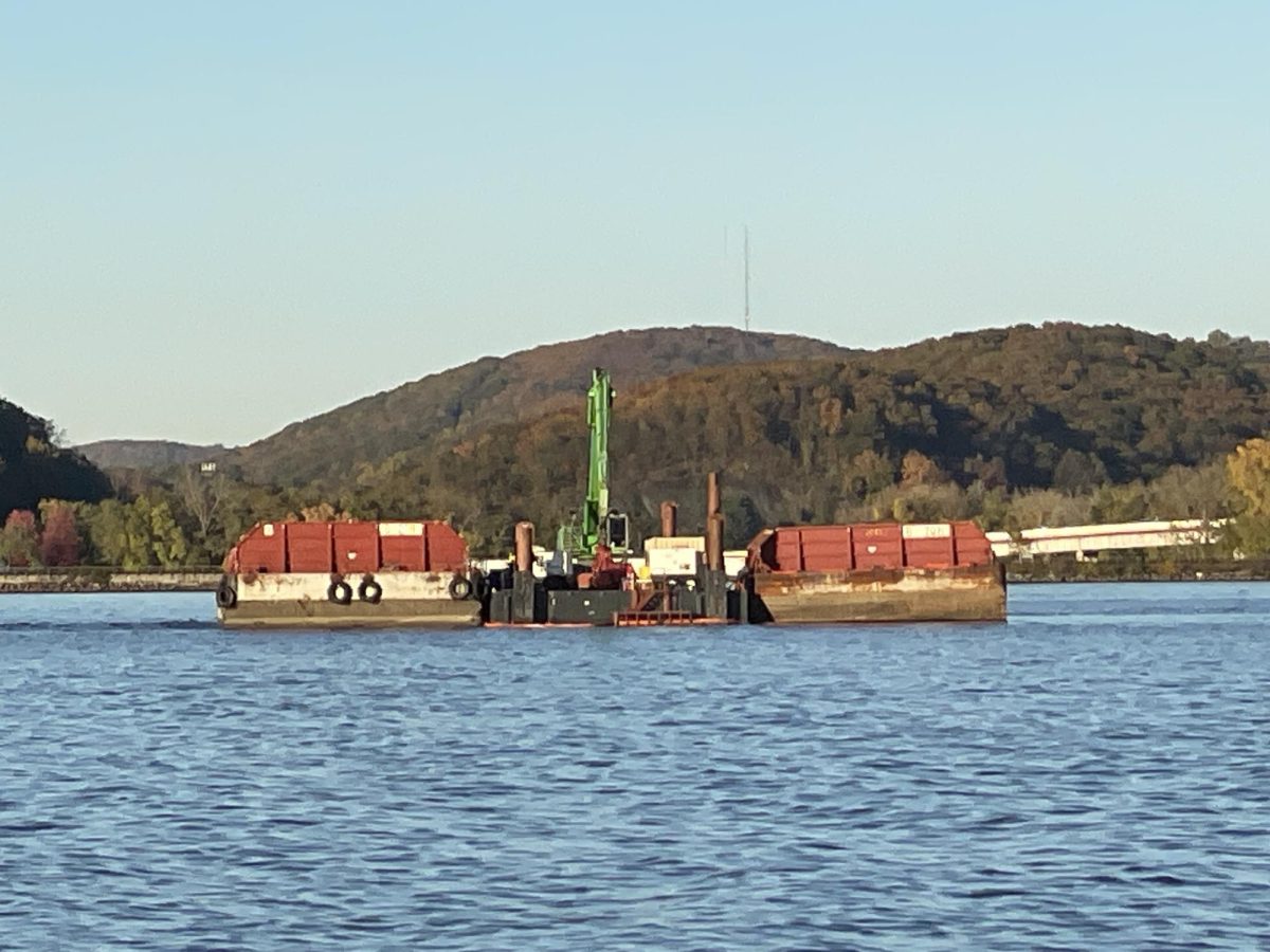 Every morning around 6:45 a.m., a small tender boat would carry workers from the Yacht Club to the barge, where they would spend the day at.