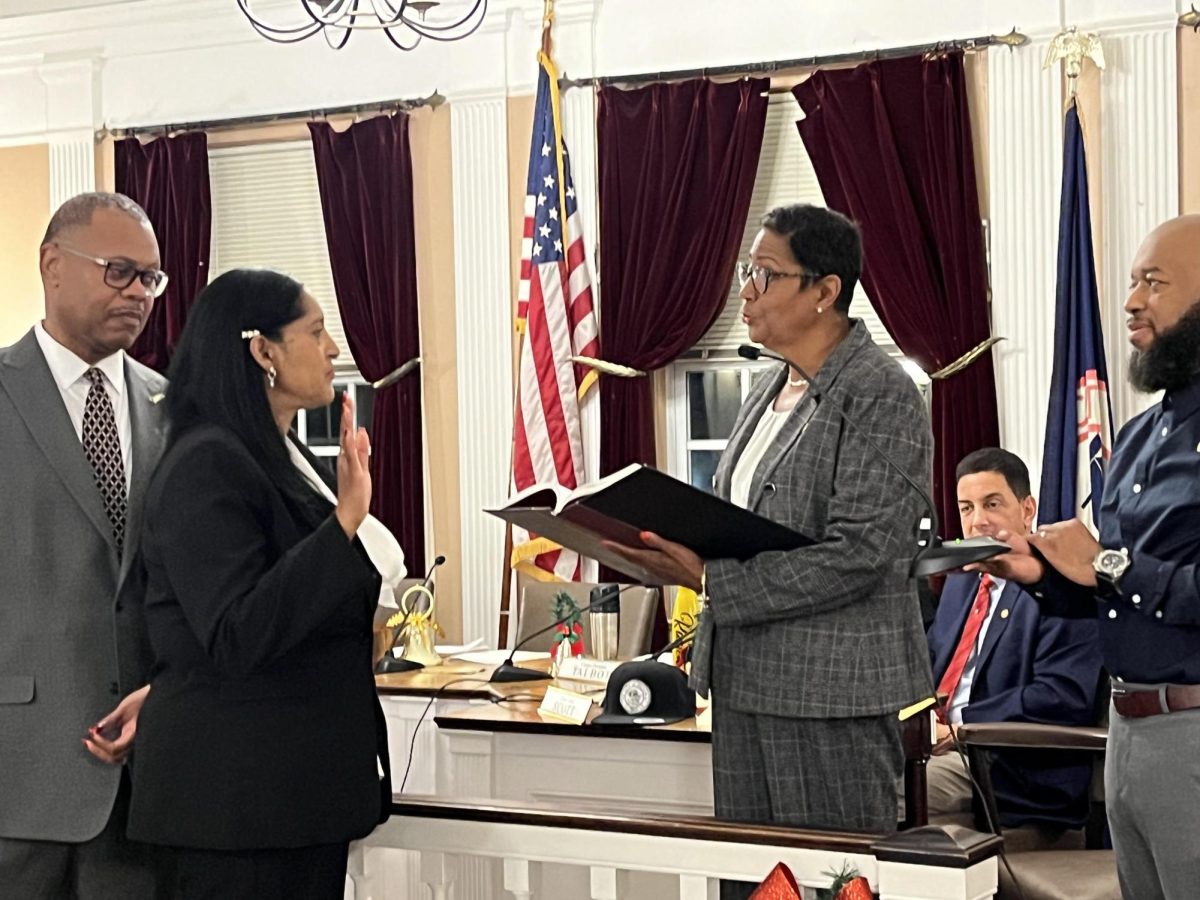 Sophia Trott being sworn in as the new Peekskill City Court Judge by Mayor Vivan McKenzie on Dec. 2. To Trott’s left is her husband, Ernest Faulkner, a former NYPD officer. Trott and Faulkner have three children from a blended family, including Trott’s daughter who is a police officer in Mount Vernon.