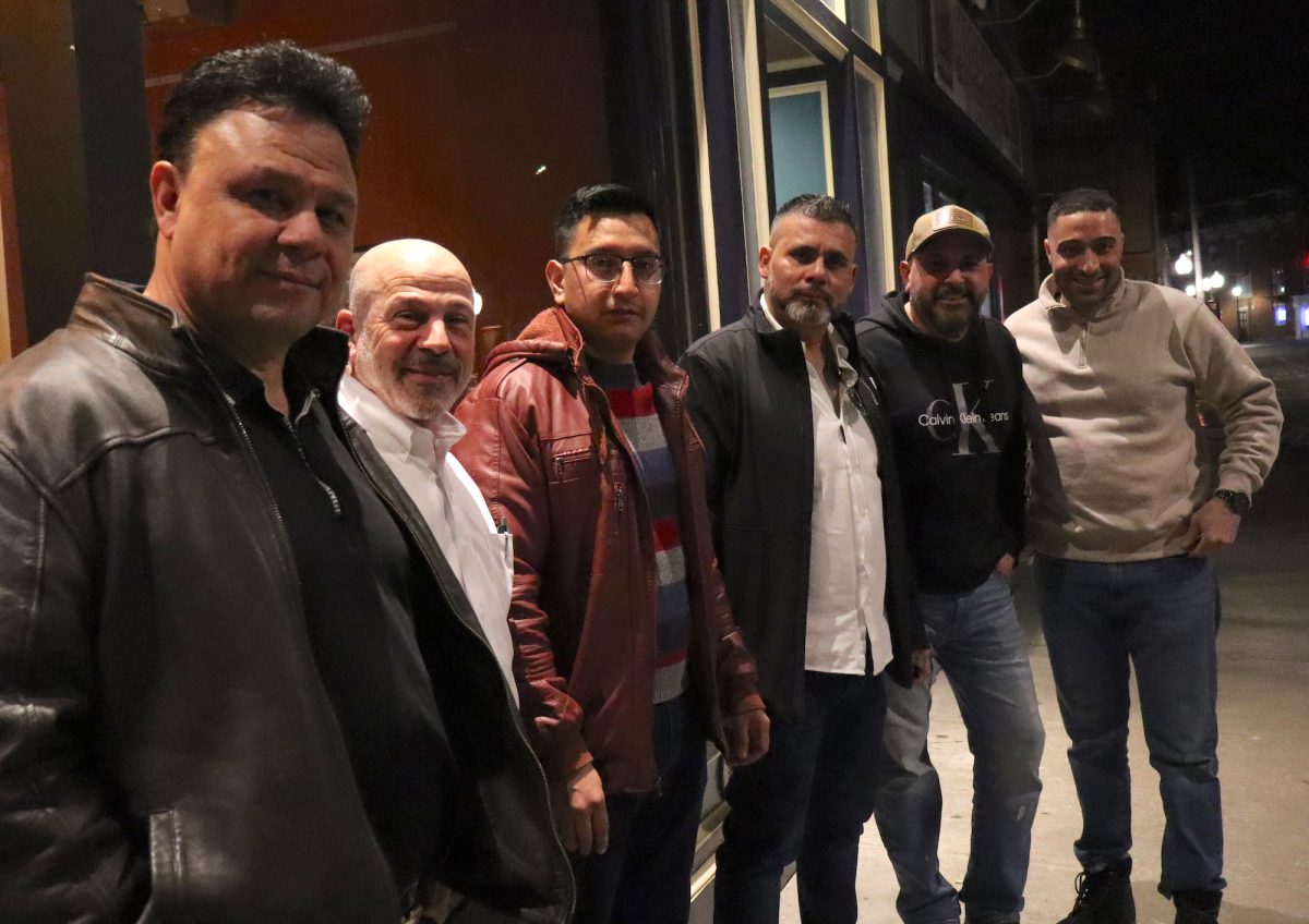 Standing outside of Gauchos Steakhouse from left to right; Ruben Alvarez (Ruben’s Mexican Café), Arne Paglia (Division Street Grill), Alex Mendia (Gauchos Steakhouse), Emiliano Peréz (Perla de Oriente Panaderia), Hever Palacios (Taco District and Iron Vine), Victor Garrido (Garrido Realty). Photo credit: Eric Harvey.