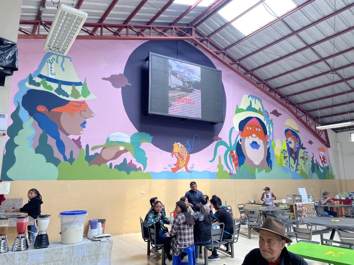 Customers at the Girón market sit and enjoy the food they've purchased. Photo  credit: Regina Clarkin. 