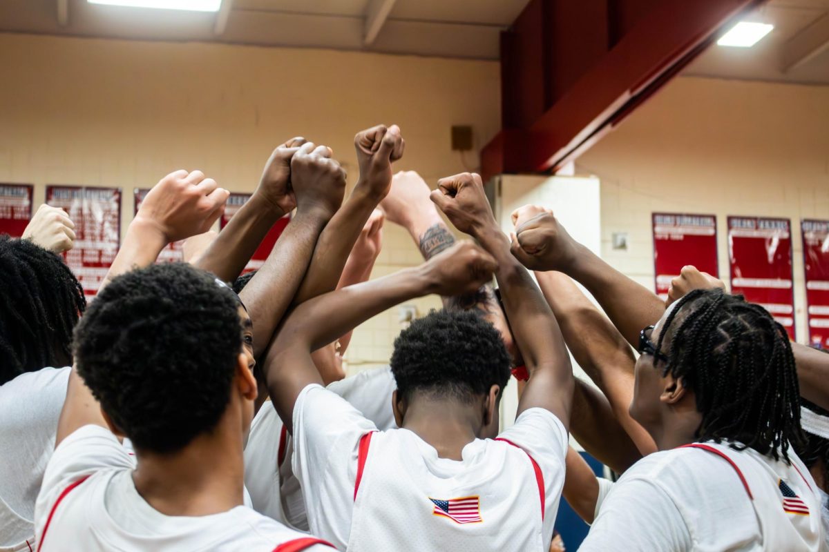 Peekskill Red Devils enjoy victorious team huddle.