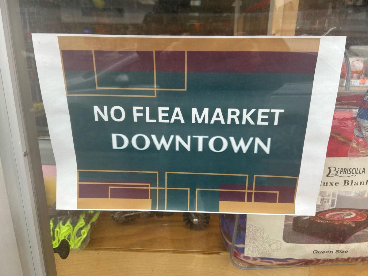 Signs across Peekskill's downtown against the Sunday flea market, which draws 2000 people to the city weekly. (Luke Davenport)