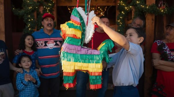 Piñatas, colorful and filled with sweets, are always a favorite among children during the celebration. 