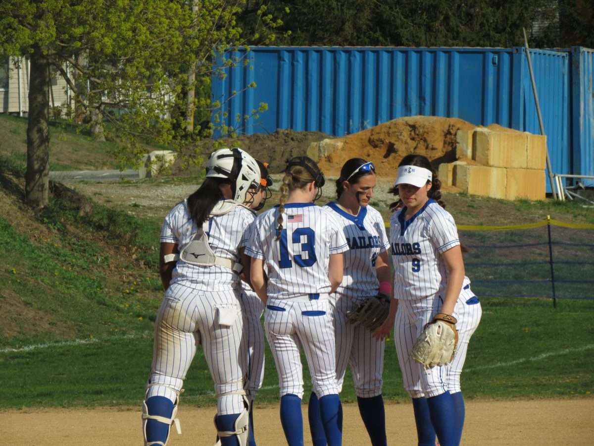 Hen Hud team huddle against Harrison April 23. 