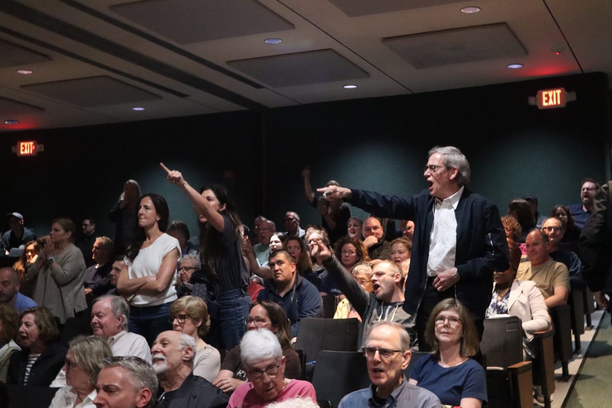 Constituents of U.S. Rep. Mike Lawler point accusatory fingers towards him on stage during his Westchester town hall.