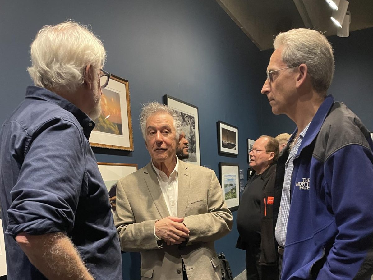 Joseph Squillante (center) at the May 8, 2025, opening of his "Lens on the Hudson" exhibit at the Hudson River Museum. 
