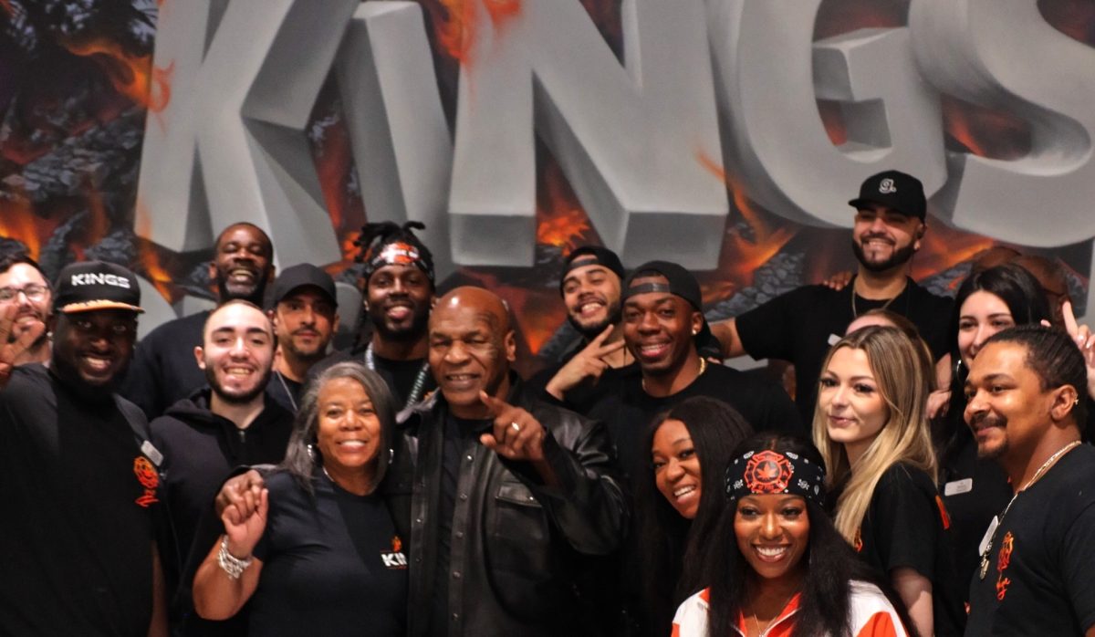 Mike Tyson poses recently at Kings House of Fire with lucky team members. (Supplied)