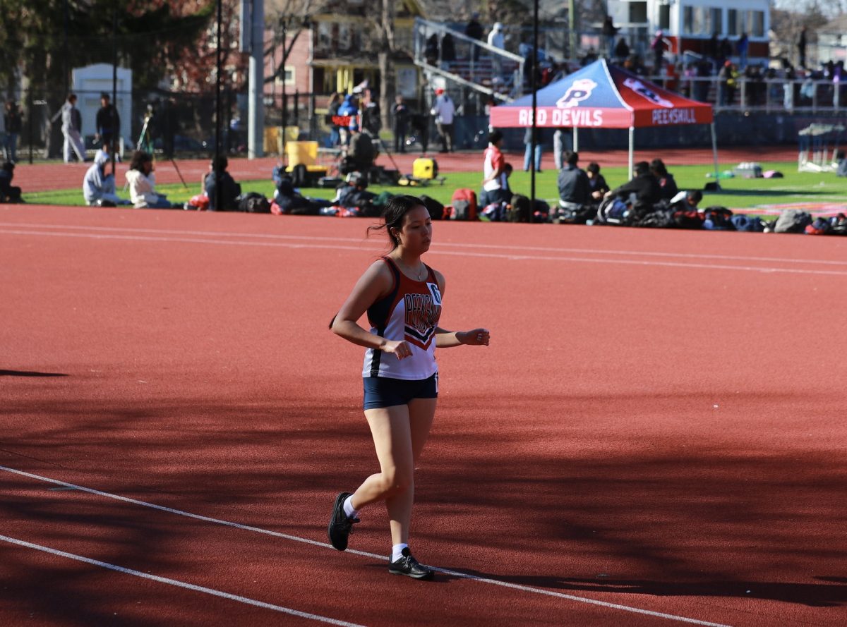 [Race walk photo here. Caption: Specce competing during the 2025 spring season. Peekskill City School District