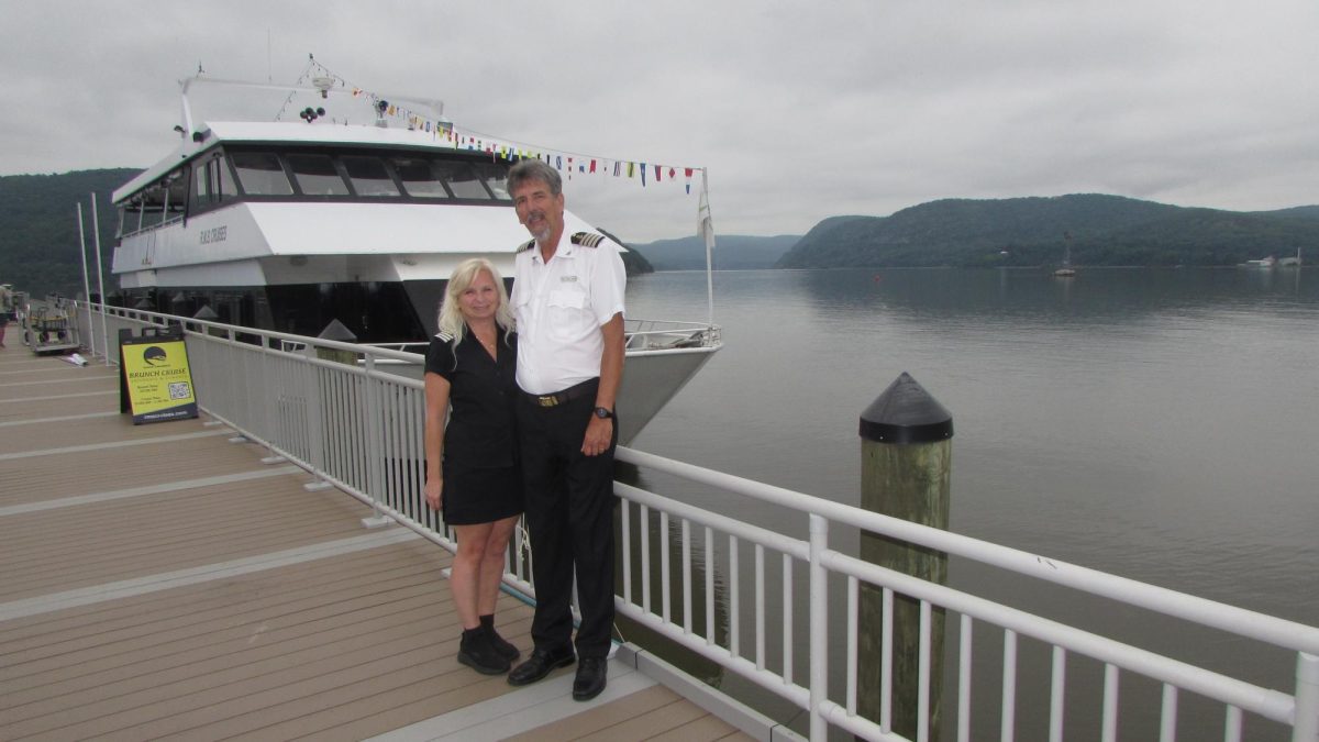 Laura and Frank Adam at Fleischmann Pier with their Emerald Princess in the background. 