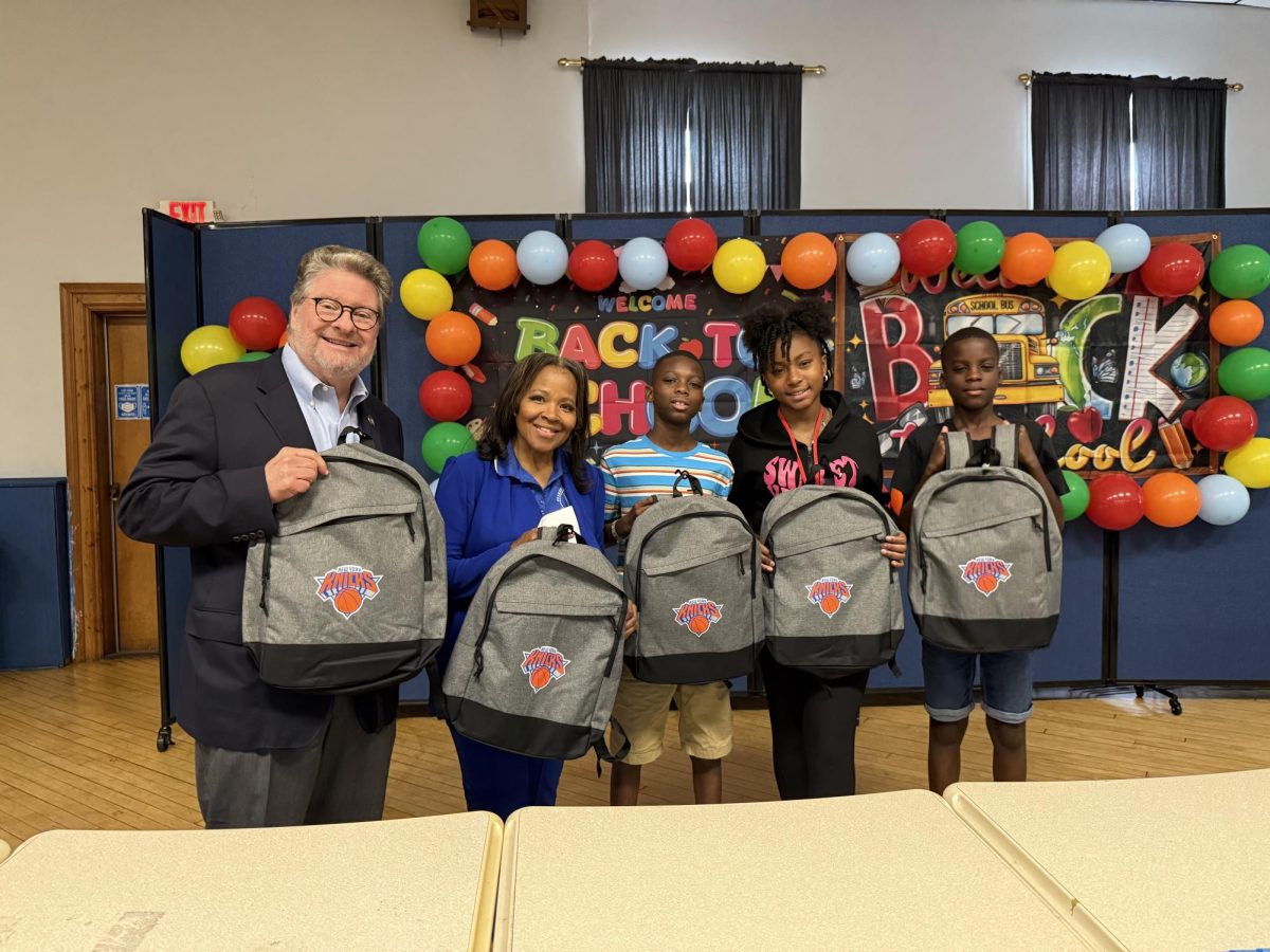 Senator Pete Harckham, Tuesday Paige McDonald, Executive Director at the Youth Bureau,  pose with 7th graders, Mason Charles, Chloe Walton, and Ethan Charles at the 10th annual back-to-school supply giveaway. 
