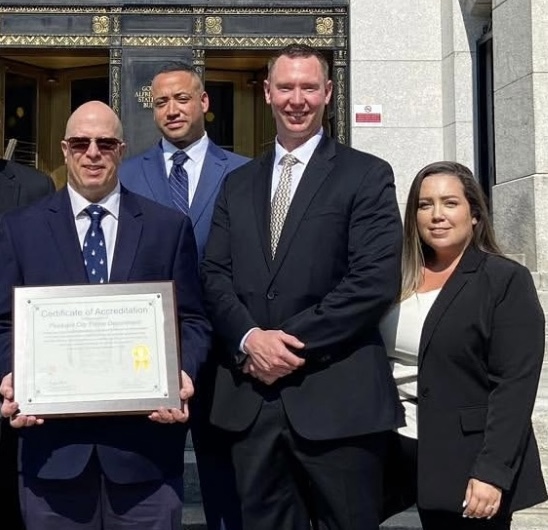 (From left) Chief of Police Leo Dylewski, former patrol officer Michael Henderson, Lt. Adam Renwick, former chief of police secretary Nicole Maban, after the department was re-accredited by the New York State Division of Criminal Justice Services in September 2024. (City of Peekskill Police Department)