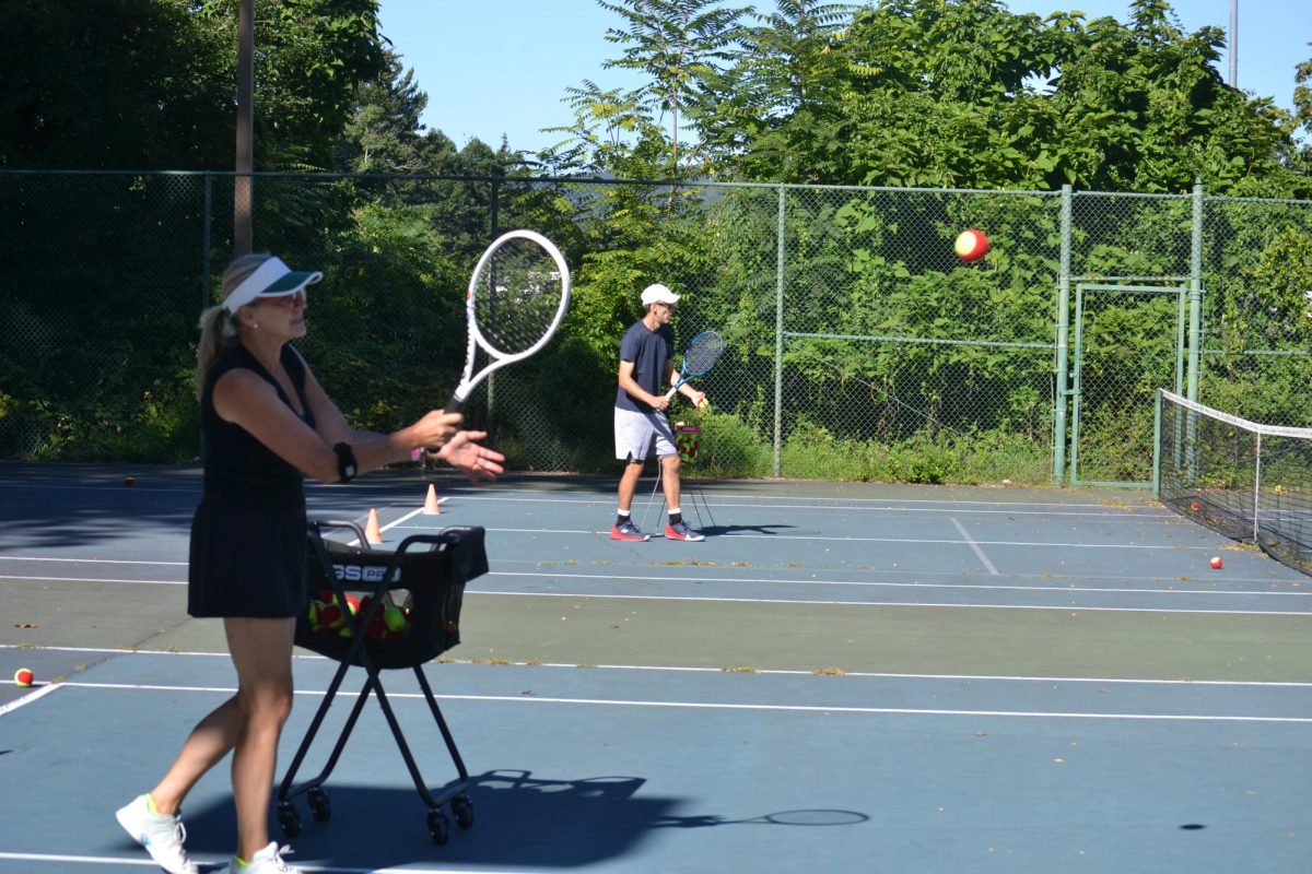 Peekskill Racket Association’s Jana Platina (front) and Alex Smith (back) during a tennis lesson on August 30. (Sheyla Cortorreal)