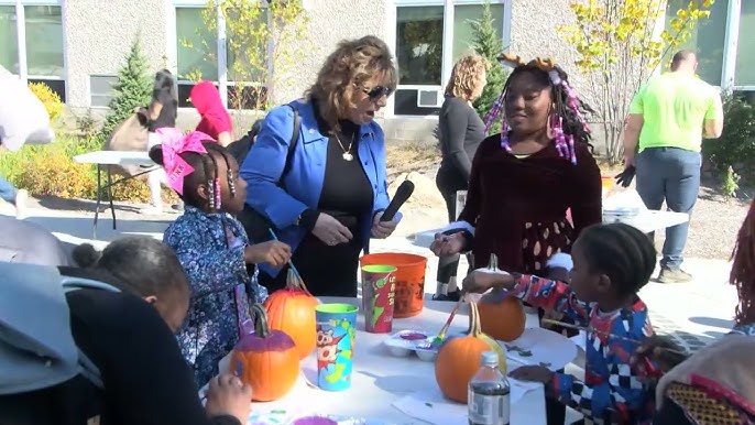At a previous event, Peekskill Deputy Mayor Patricia Riley (with microphone) delights in seeing the kids have fun. (City of Peekskill)