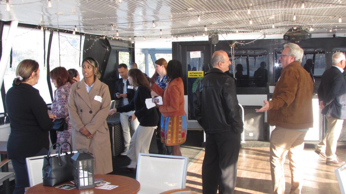 Chamber members and guests mingle on board on Thursday, Oct. 9. (