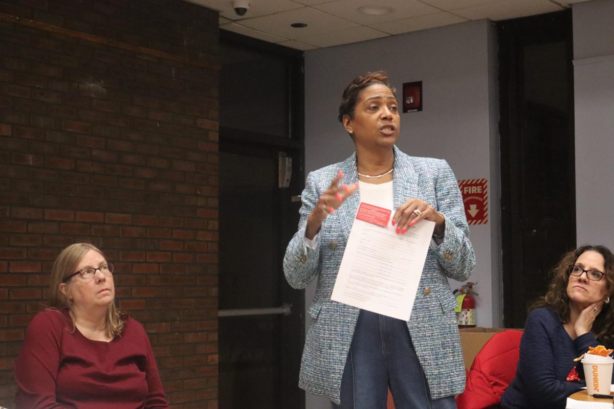 Peekskill Mayor Vivian McKenzie displays a guardian form for parents in the event they are deported, and a “Know Your Rights” card, at a Peekskill Democratic City Committee meeting on Jan. 23, 2025.