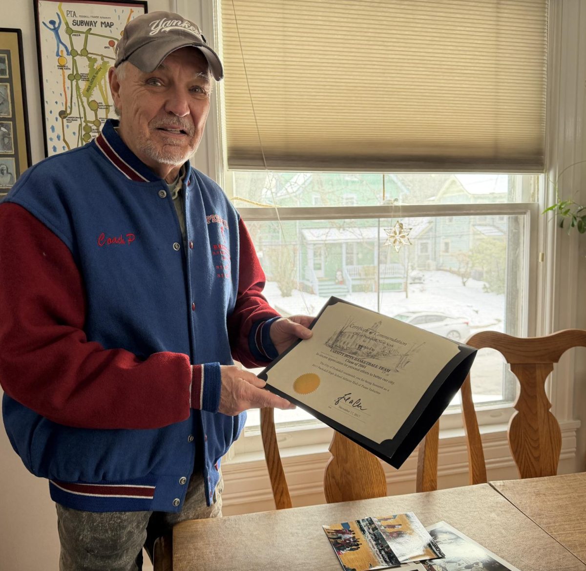 Former Peekskill basketball coach and athletic director Lou Panzanaro stopped by Peekskill Herald headquarters earlier this month to drop off items for this story. 