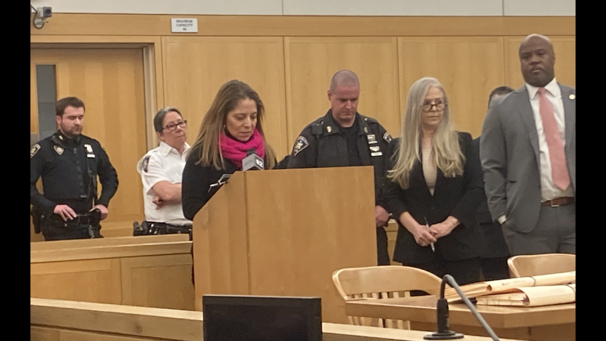 Linda Angiento, a Department of Social Services (DSS) supervisor, reads impact statement at Jenkins' sentencing. (Media pool photo)