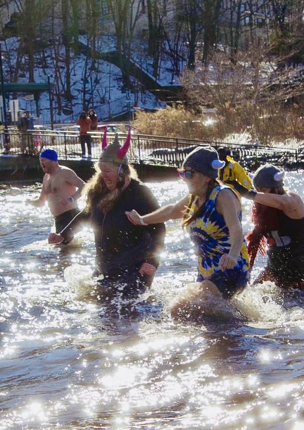 Plungers gingerly wade into the water. 