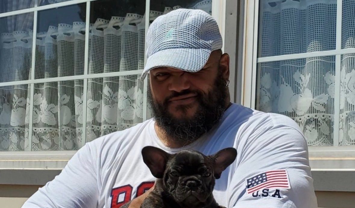 Tre Johnson with one of his beloved dogs. (Supplied)