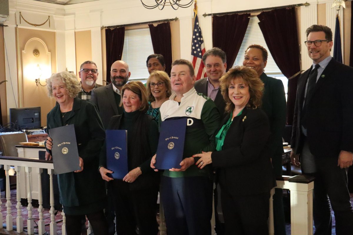 (From left) honoree Regina Clarkin, Councilmembers Brian Fassett and Charles DiGruccio, honoree Karen Kelley, Mayor Vivian McKenzie, Councilwoman Kathleen Talbot, honoree Kevin Riley, Councilman Darren Rigger, Deputy Mayor Patricia Riley, Councilwoman Beverley Chang, City Manager Matthew Alexander. (Eric Harvey)