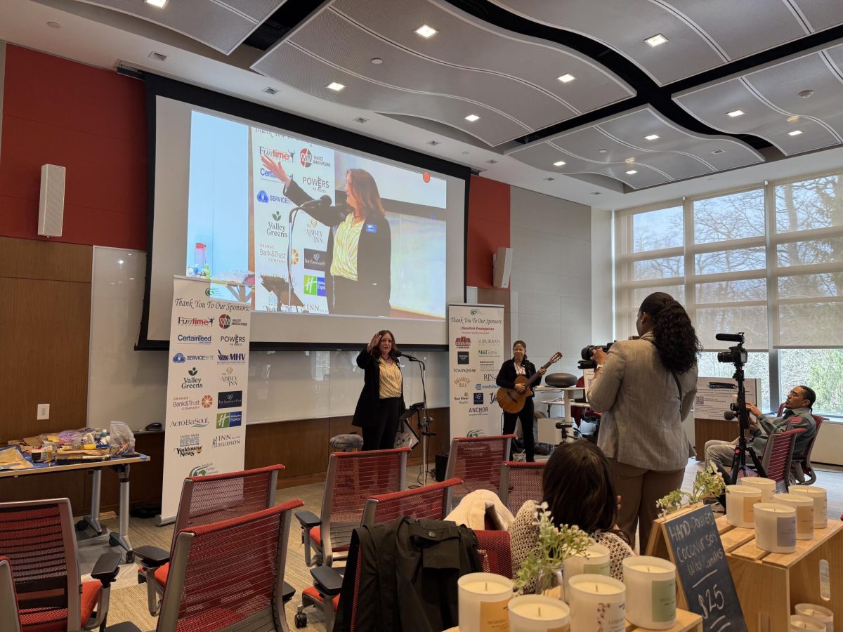 Carole Voisey, Executive Director of the Hudson Valley Gateway Chamber of Commerce, opens the third annual Celebrating Women in business event at Windrose On Hudson Hotel and Conference Center on March 27. 