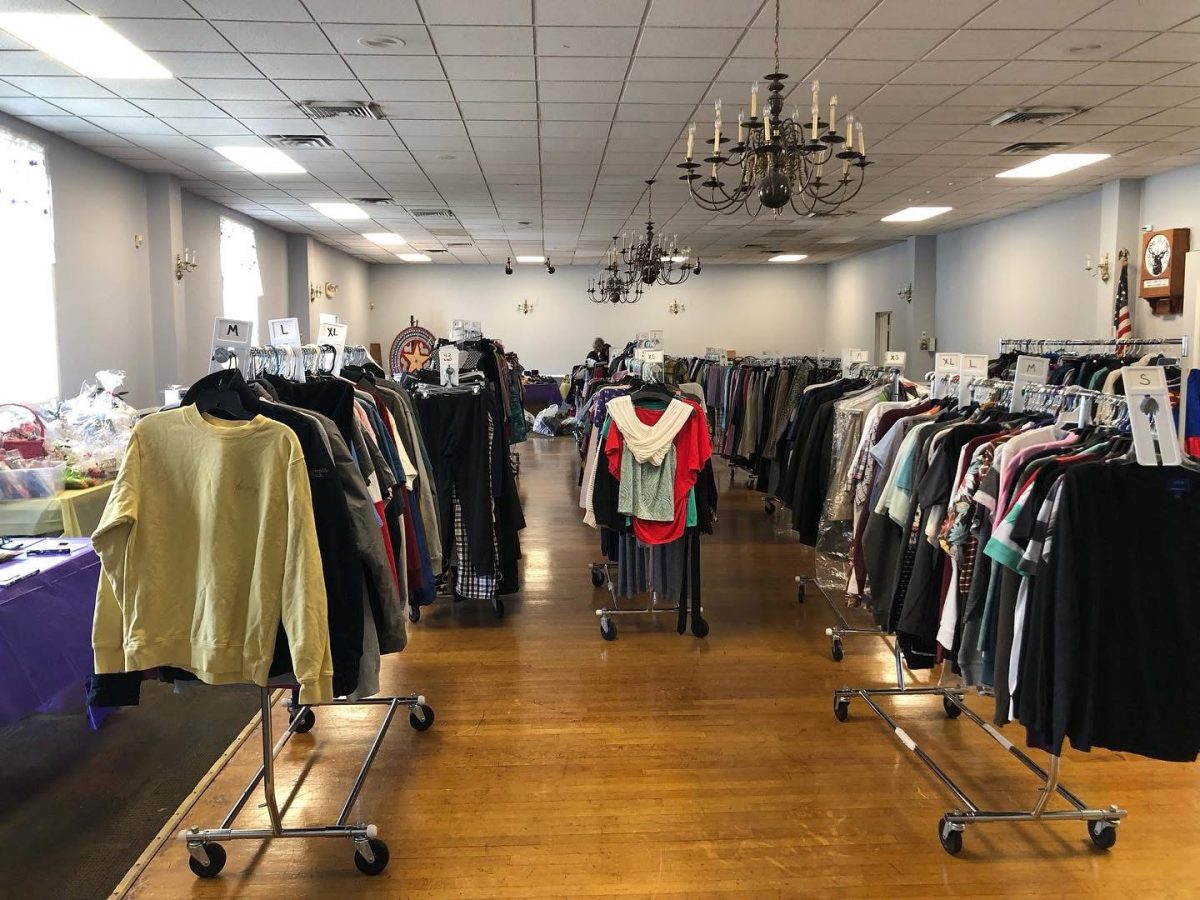 Clothing, shoes and textile items are organized by category and size inside the main hall of Elks Lodge #744 to facilitate access for attendees during the Community Closet event. (Elks)