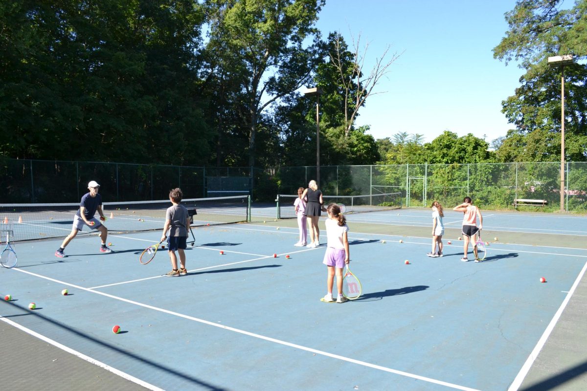 Children practice with Alex Smith and Jana Platina of the Peekskill Racket Association in August 2025. 