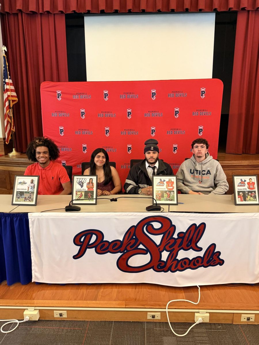 Peekskill student-athletes on Senior Signing Day on June 9. From left: Elijah Mckenzie, Jackelin Alfaro, Darnell Hinton Jr, and Rocco D’Elia. (Peekskill City School District)