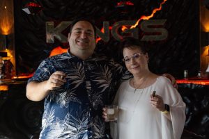Club members Michael DeNoia and Caroline Oschwald enjoying a cigar at Kings House of Smoke. (AGSD Media)
