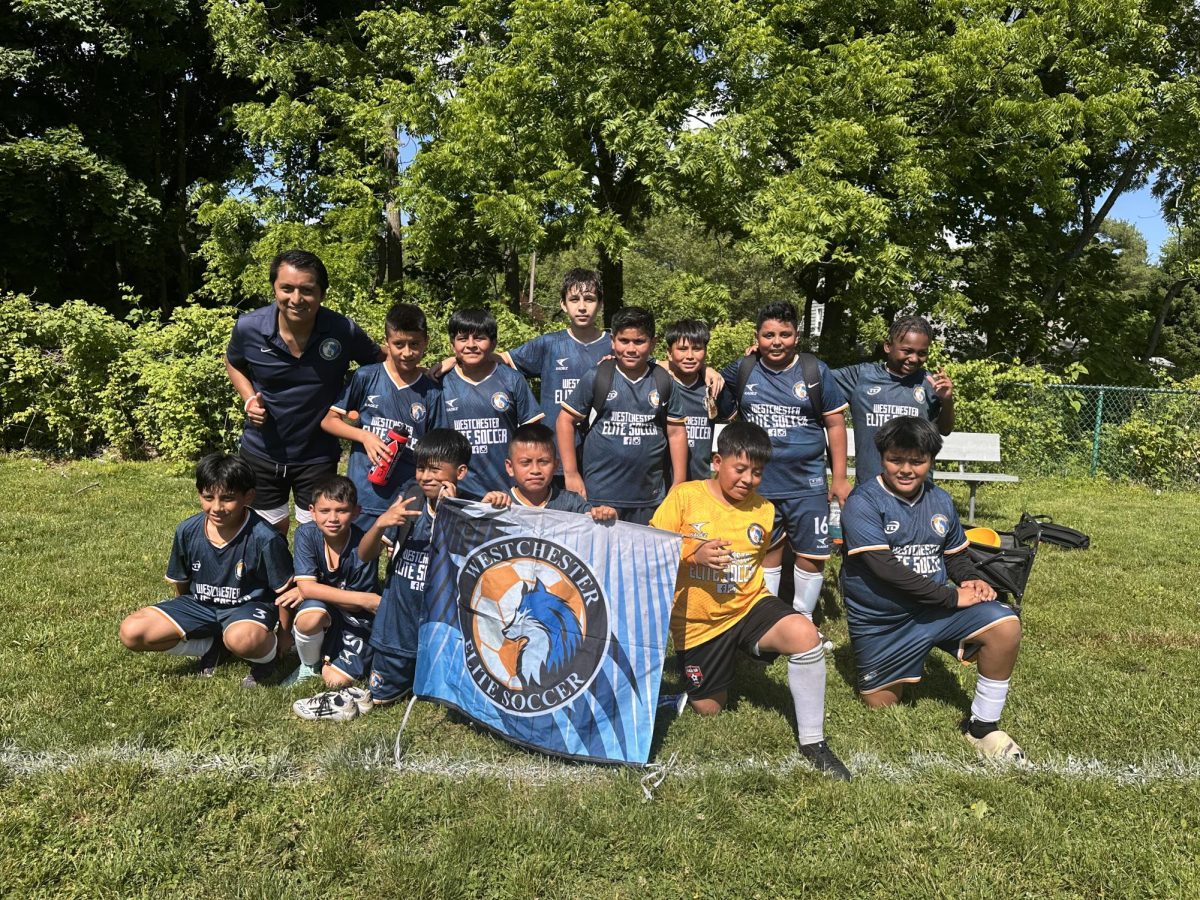 Flavio Zhingri (left) with athletes from his Westchester Elite Soccer academy. (Supplied)